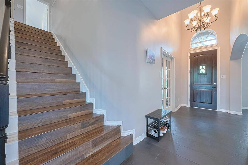 Up the stairs goes to a game room, four bedrooms, and two bathrooms.