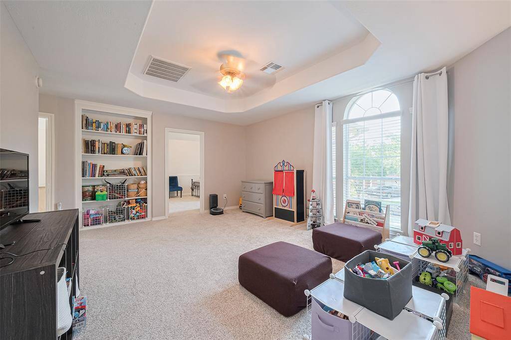 Game Room with built in shelving.