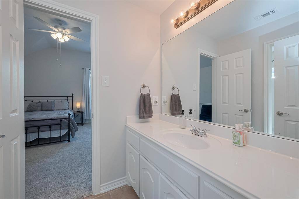 Jack and Jill bathroom with separate vanity.