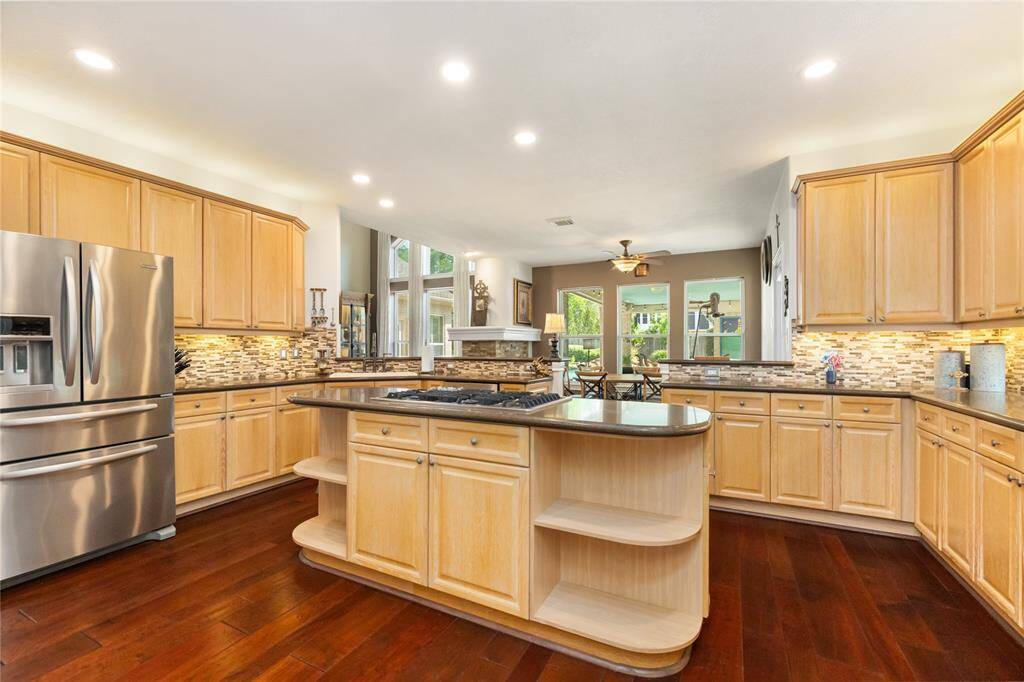 This kitchen not only impresses with its warm cabinetry and functional layout, but also features a series of recent upgrades: a new cooktop and oven added in 2019, a new microwave in 2022, and a new dishwasher in 2023. Every detail is designed to enhance your cooking experience with both style and reliability.
