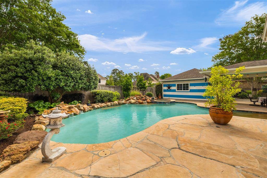 Surrounded by elegant stone decking and lush landscaping, the space offers privacy, tranquility, and endless opportunities to entertain or unwind.