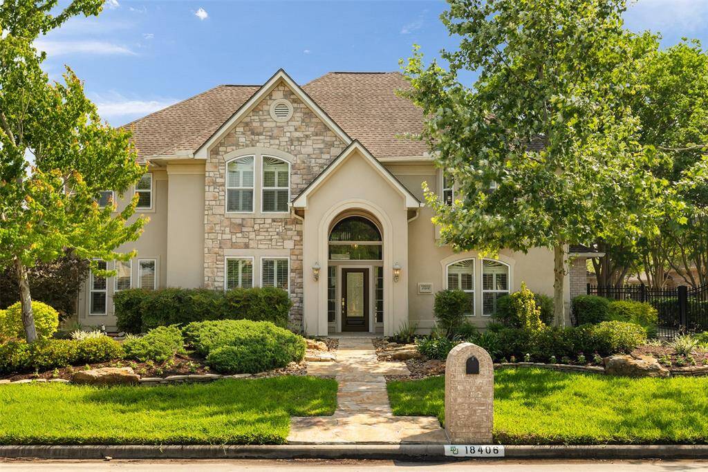 A glimpse of elegance and charm. Surrounded by mature trees, the stone pathway leads you to the front door, inviting you to explore the stunning spaces and luxurious details found inside.