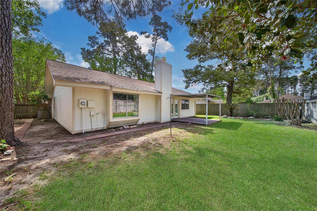 Large backyard, with covered patio and freshly painted exterior