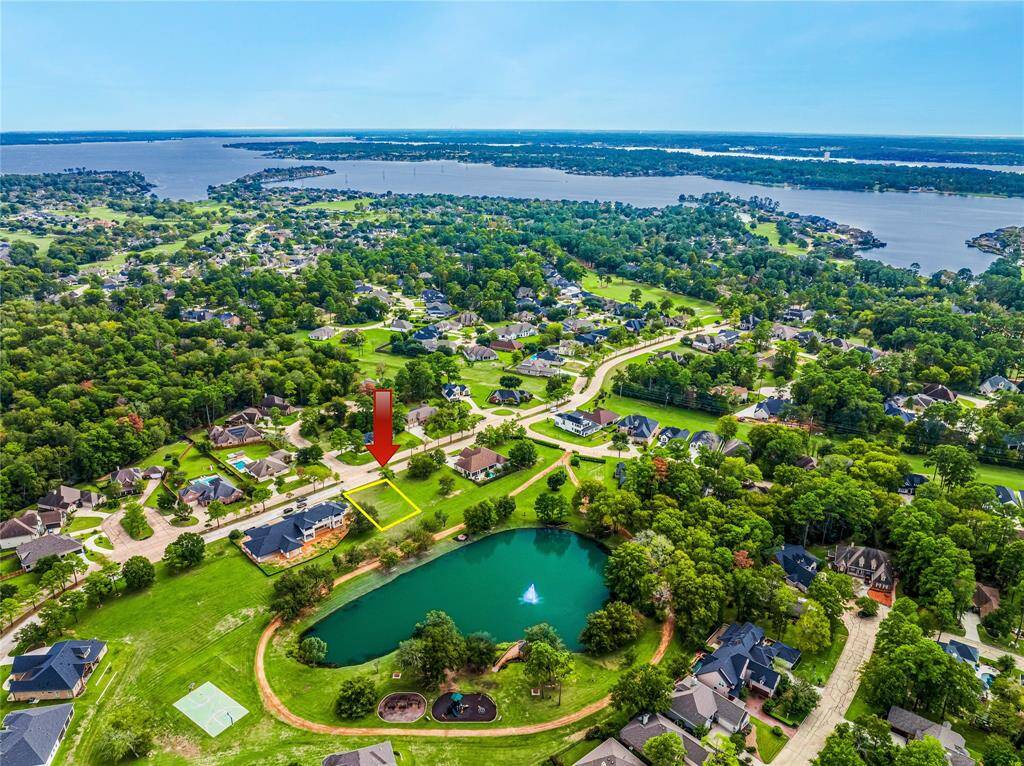 Aerial view showing the defined lot, the Park in the Meadows and the close proximity to beautiful Lake Conroe!