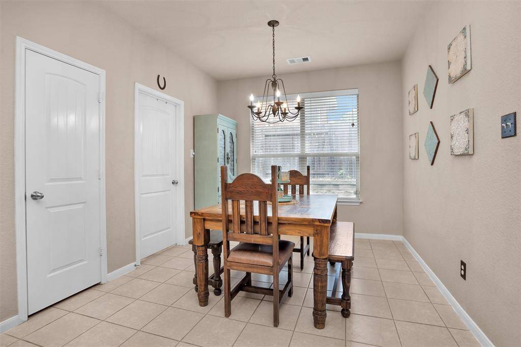 Cozy breakfast nook with ample natural light, perfect for morning meals.