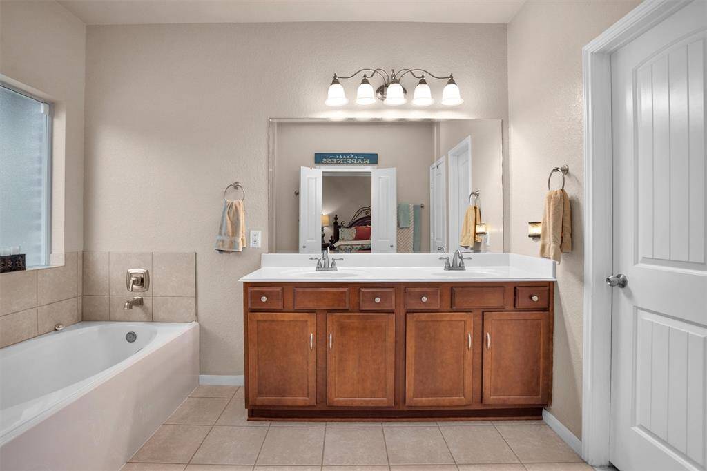 Indulge in relaxation with this inviting soaking tub, perfect for unwinding at the end of the day.
