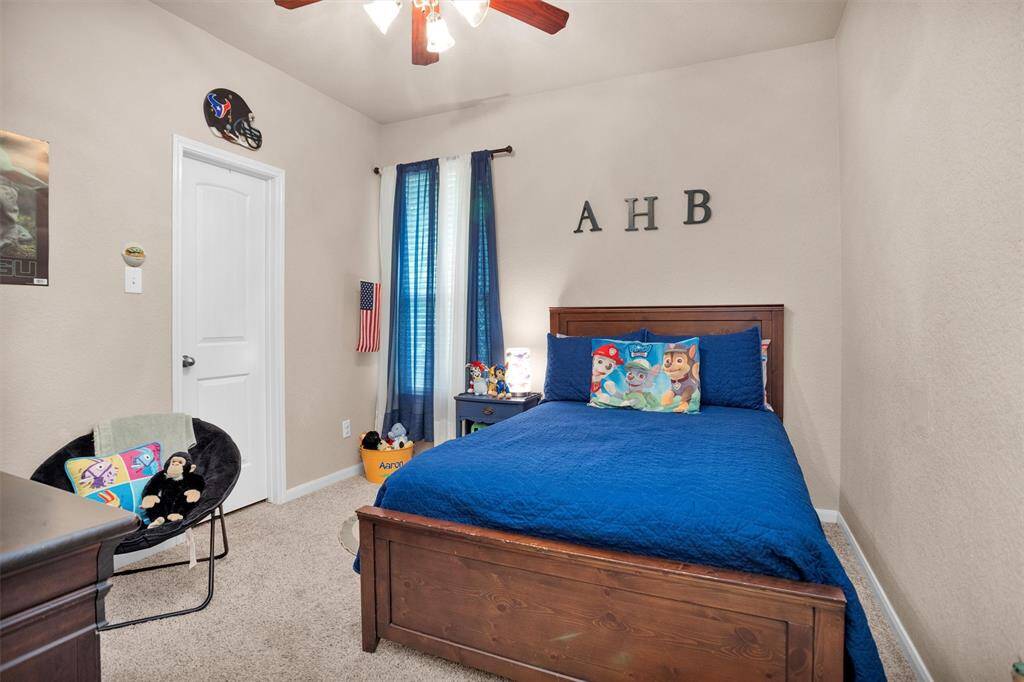 One of the three inviting downstairs bedrooms, perfect for comfort and style.