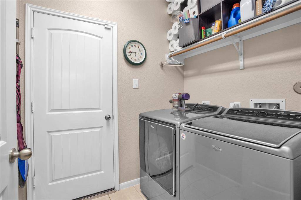 Convenient indoor laundry room adjacent to the kitchen.