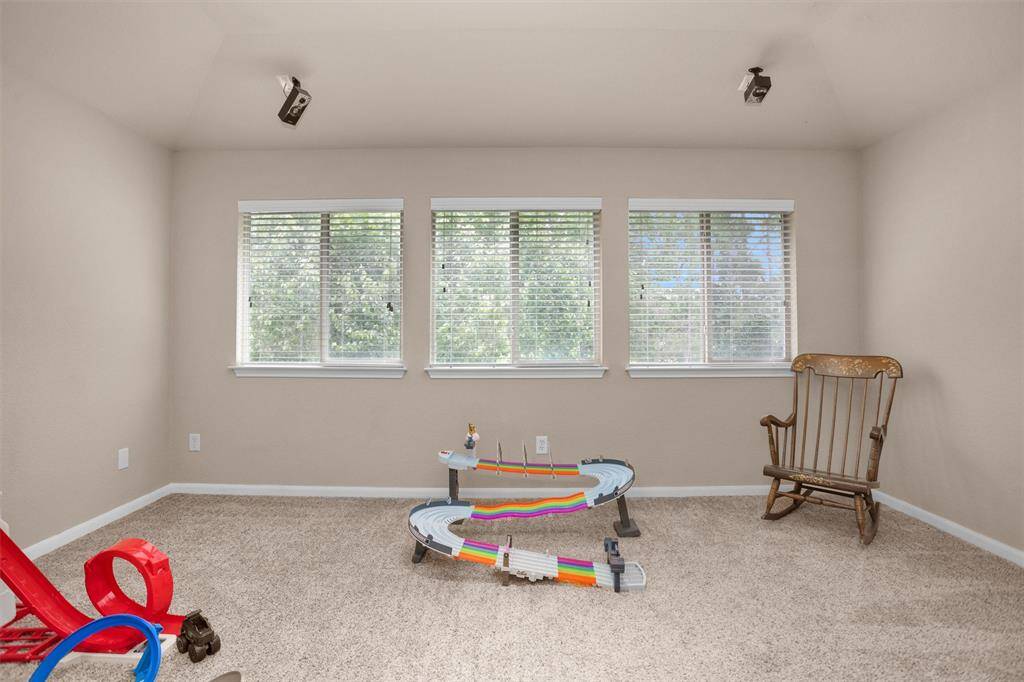 Versatile room perfect for a media space, home office, or additional bedroom.