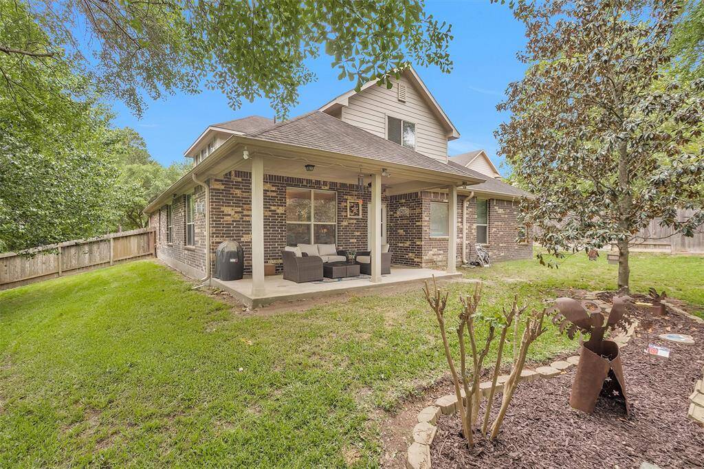 Spacious covered patio perfect for relaxing or entertaining.