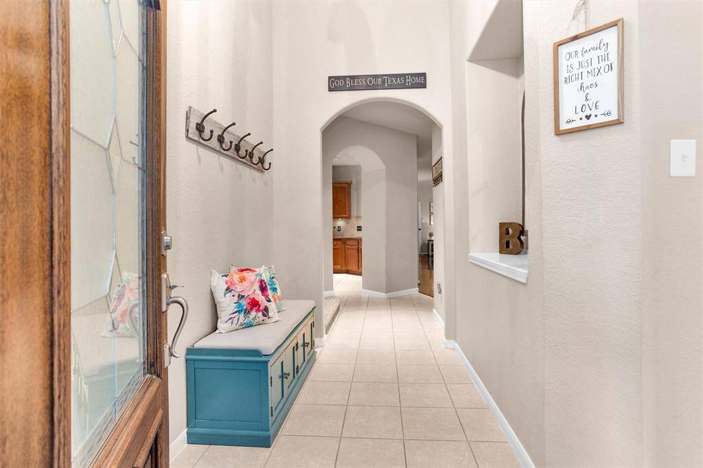 Step into a bright and welcoming entryway, filled with natural light and charm.