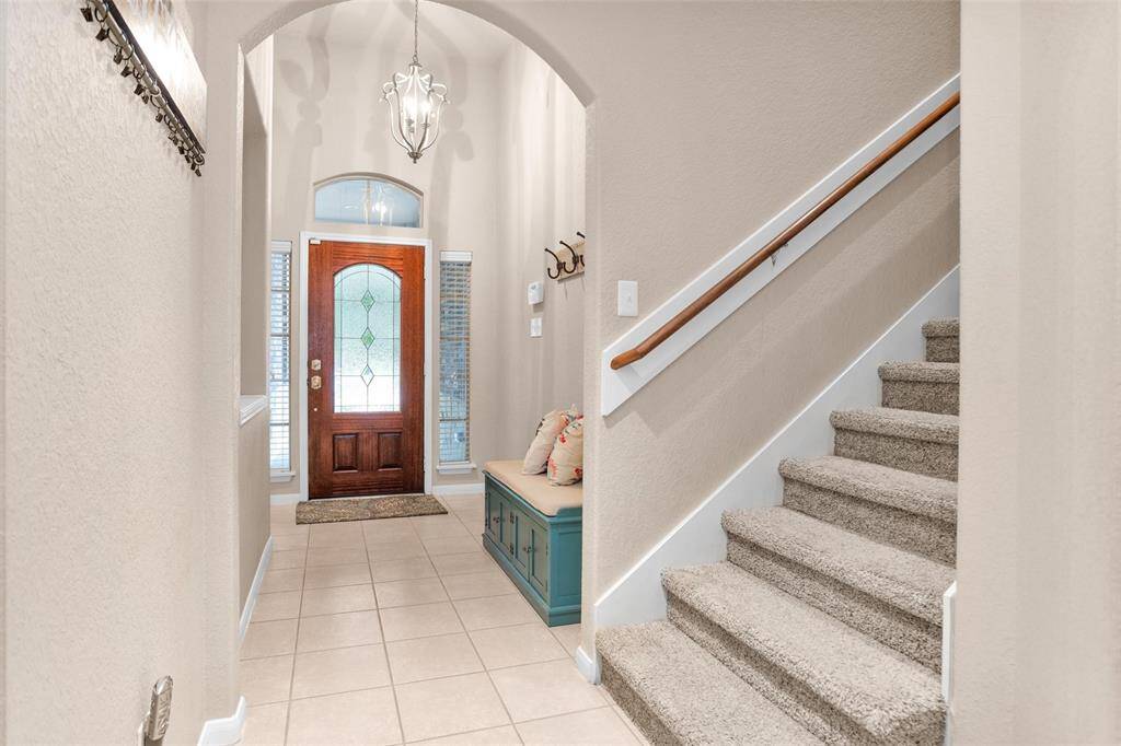 Elegant stairway perfectly positioned for easy access and flow.
