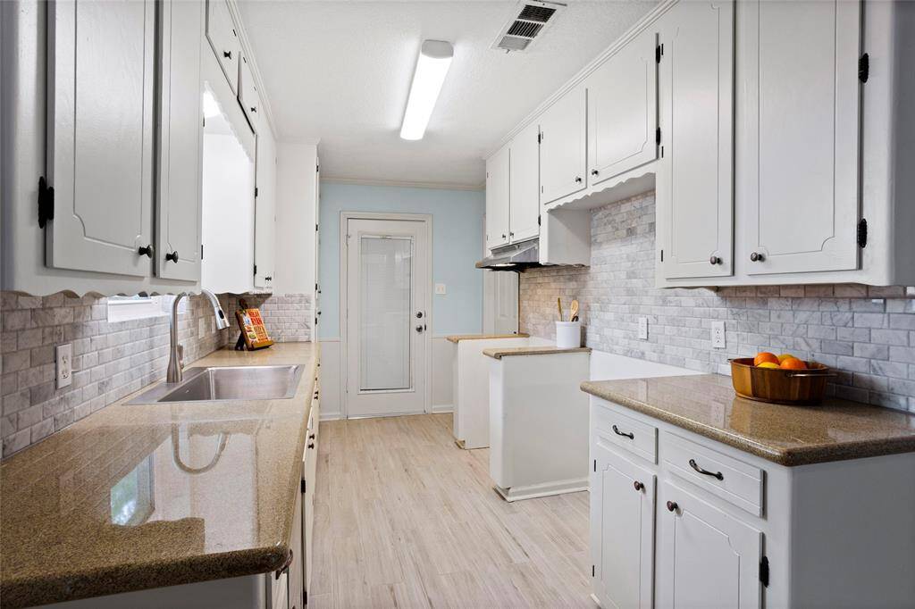 Galley kitchen with tons of cabinet space!