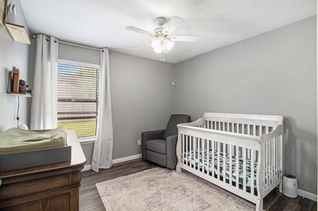 The second bedroom is located on the back yard side of the home and it offers a large walk in closet.