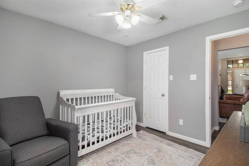 The second bedroom is located on the back yard side of the home and it offers a large walk in closet.