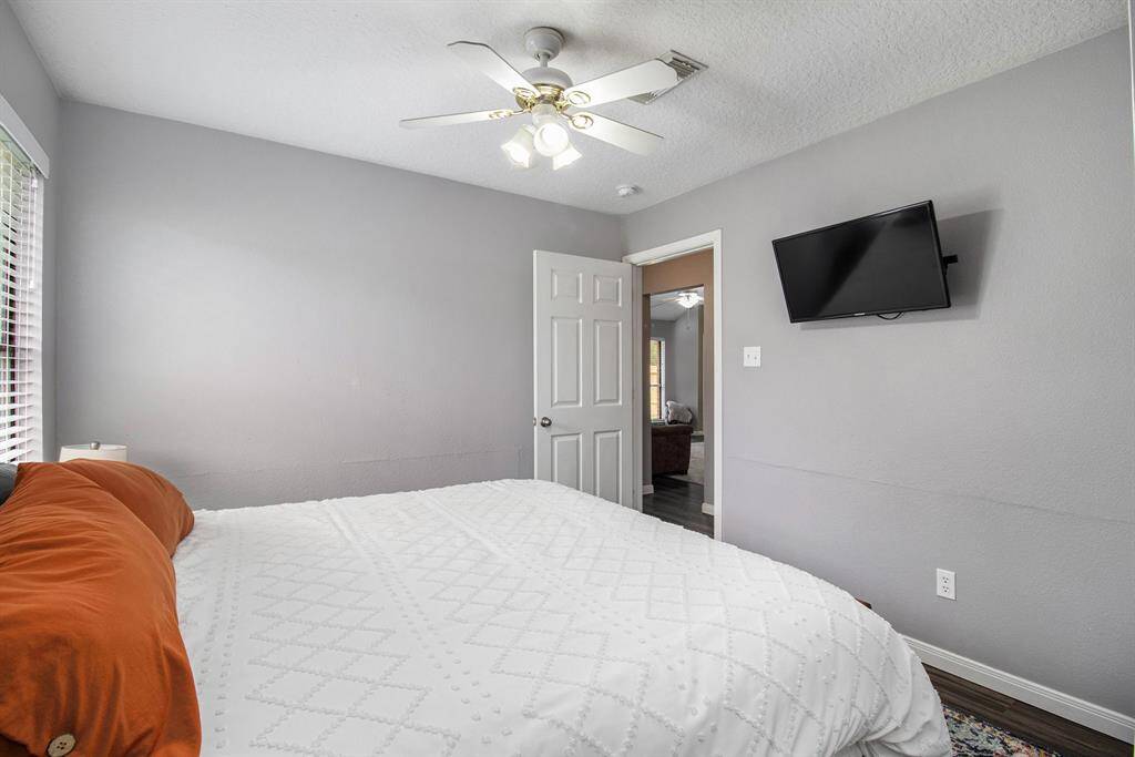 The 3rd bedroom is located at the end of the hallway and it's a great space for a quest room.