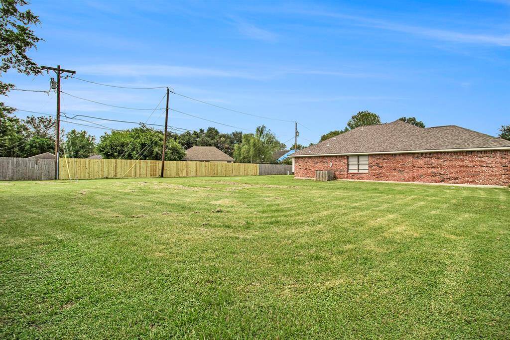 The south side of the back yard offers even more space for all the outdoors activities.