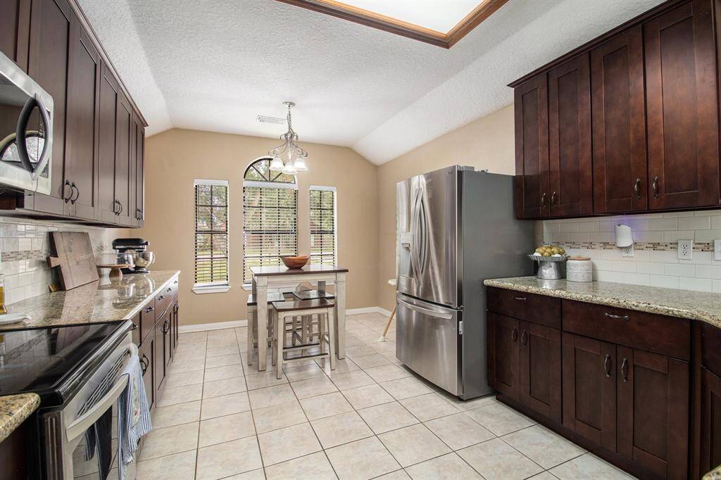 The generous space offered by the eat in kitchen is ready for all the delicious meals. Plenty of counter space and cabinets to store all your cooking gadgets.