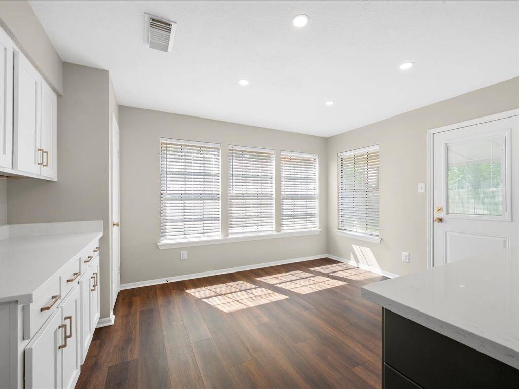 New Flooring in Kitchen; Charming Breakfast Area (new back door too)