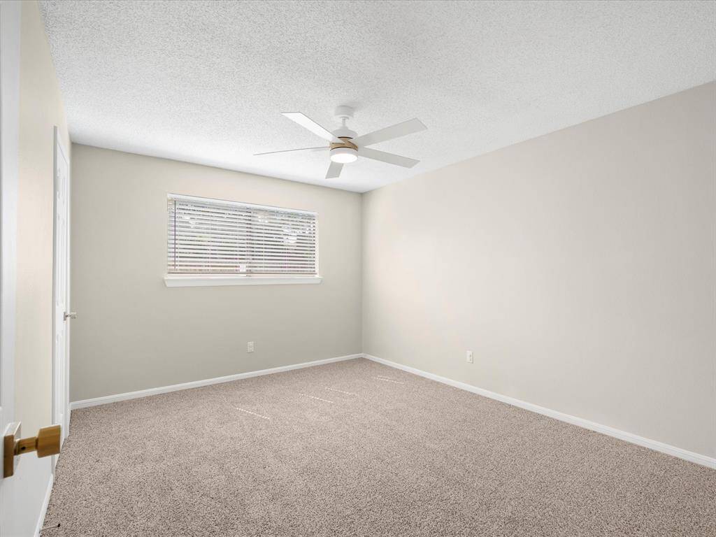 Secondary Bedroom with New Blinds & Fan; Walk In Closet