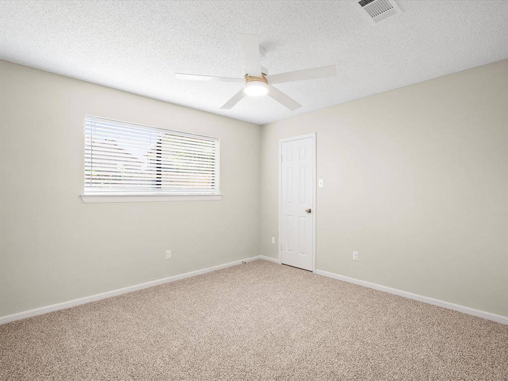 Secondary Bedroom with New Blinds & Fan; Walk In Closet