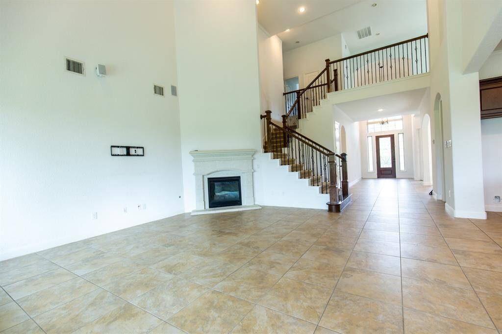 Open concept living room with soaring ceilings.