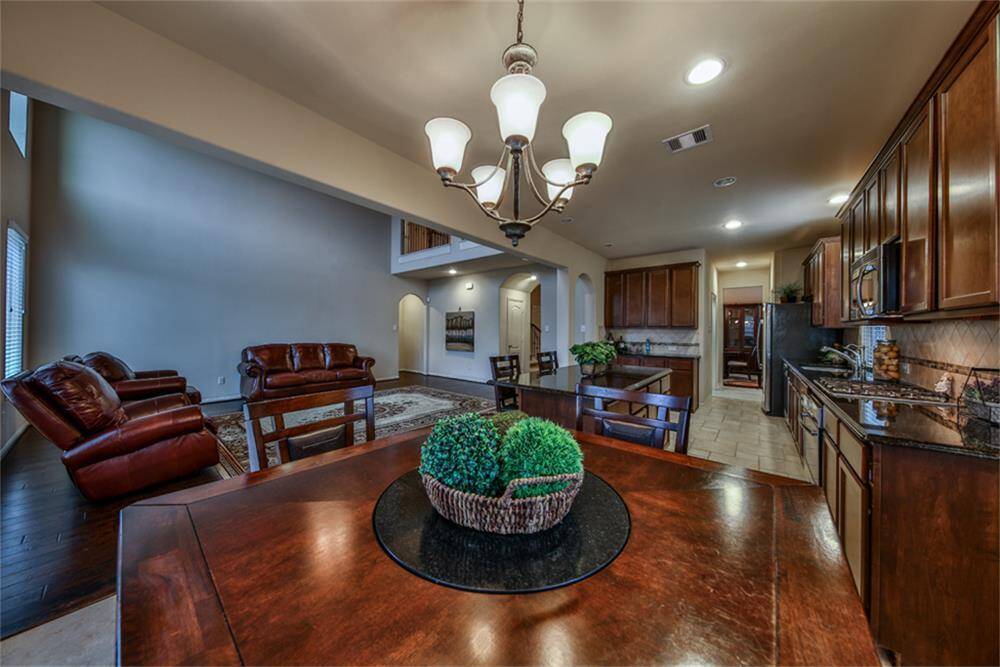 Gourmet kitchen features stunning upgraded tall inlay cabinets that offer both beauty and abundant storage. Enjoy the convenience of a spacious walk-in pantry and a large laundry room. This almost-new home is a must-see—schedule your tour today!