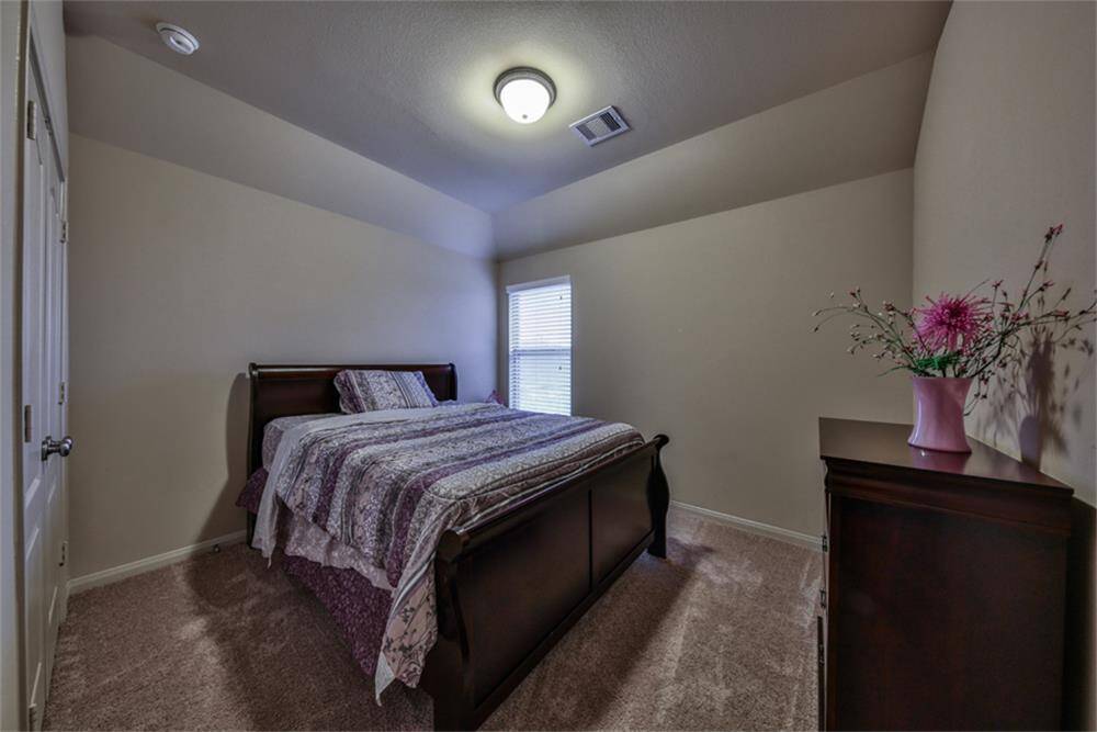 Each bedroom offers high ceilings, creating a spacious and airy feel throughout the home.