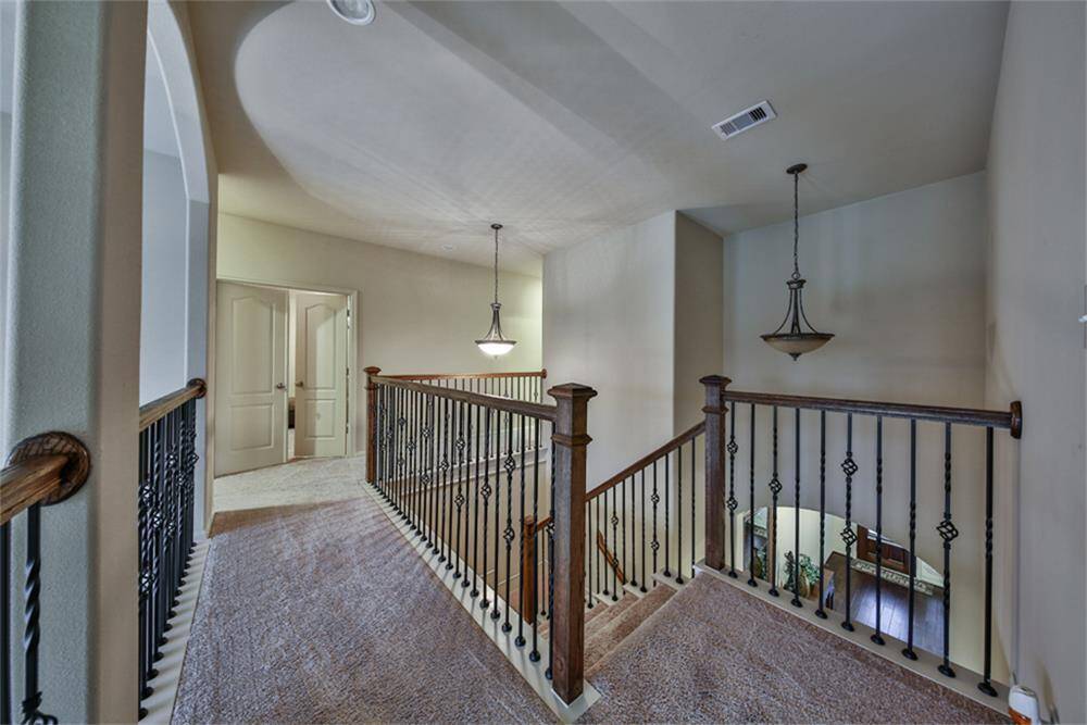 Cross the dramatic iron catwalk to the right wing of the home, where even more exceptional living spaces await!