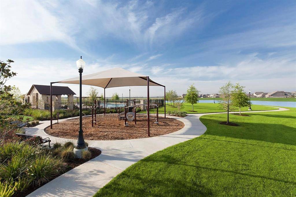 Enjoy serene outdoor spaces with a shaded pavilion—perfect for picnics, gatherings, or relaxing with a view. Surrounded by beautifully maintained greenbelts and walking paths, it's a peaceful spot to unwind in Grand Mission Estates.
