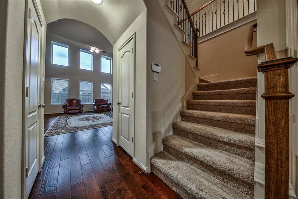 Upgraded half bathroom to the left and a spacious walk-in closet to the right—ideal for extra storage. As you enter the main living area, be wowed by the stunning wall of windows that fills the space with natural light!