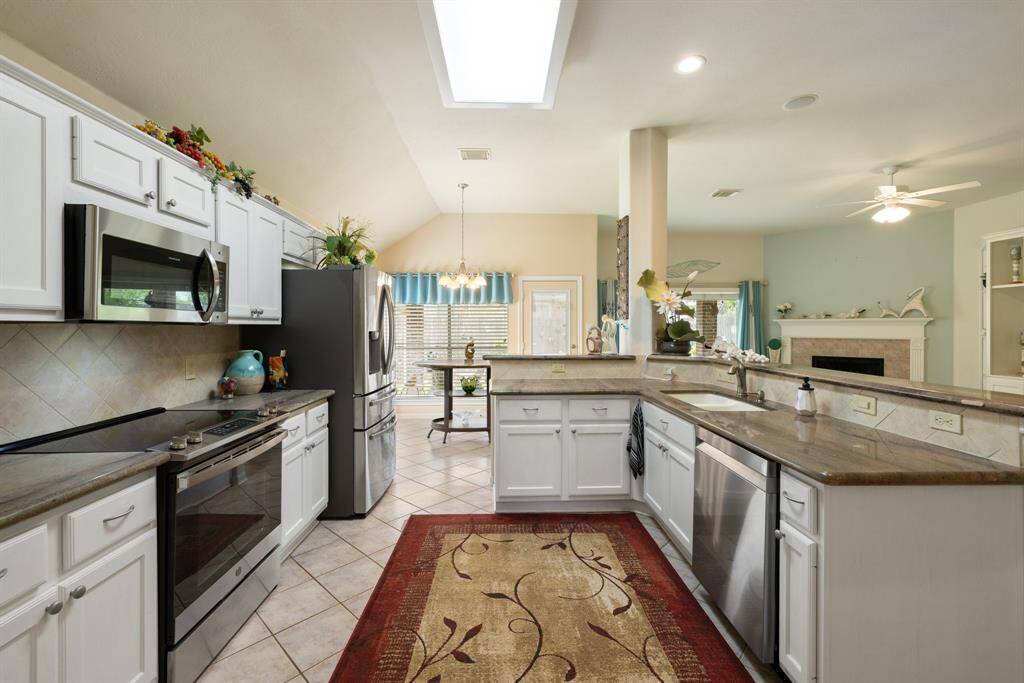Loads of counters, cabinets and stainless-steel appliances, make for a great space from the person that loves to cook or bake!