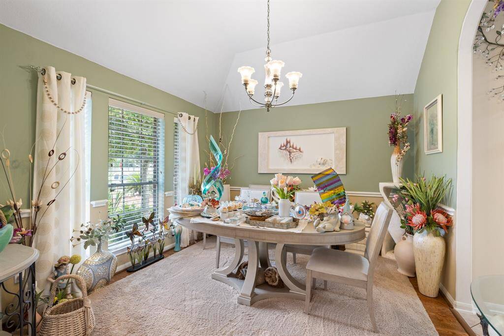 Large dining room with wood flooring.
