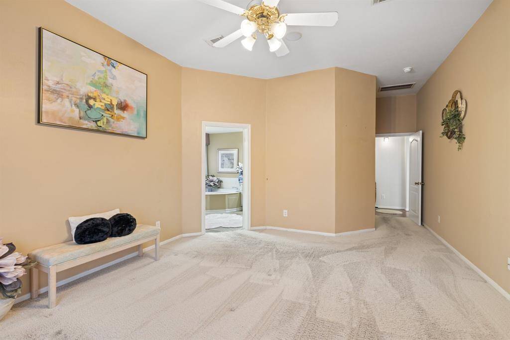 View of the primary room to the en suite bathroom.