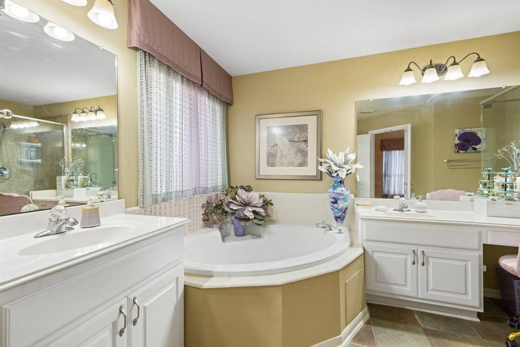 Separate vanities and huge soaking tub.