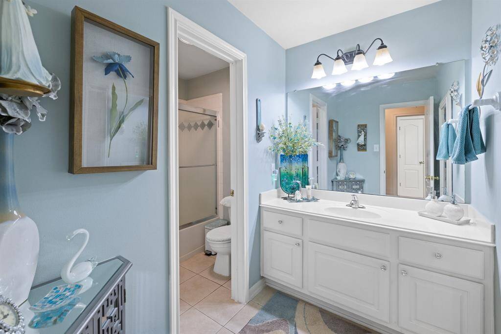 Shared bathroom with extra room for extra storage.