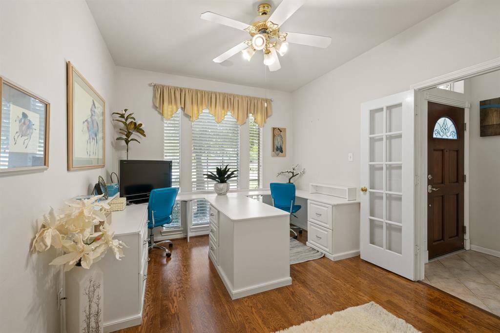 Office with built in desk.  The french doors offer privacy.