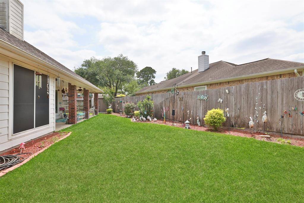 Sprinkler system keeps the yard green and full.
