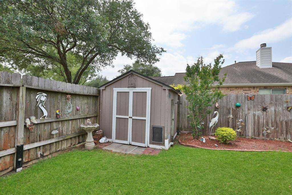 Storage shed in the back yard for you lawn equipment and toys.
