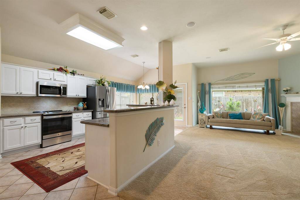 The chef's kitchen is open to the den, making entertaining a breeze.