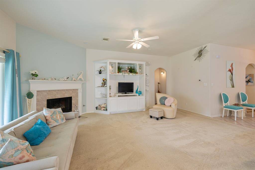 Huge den with built in shelves and surround sound.
