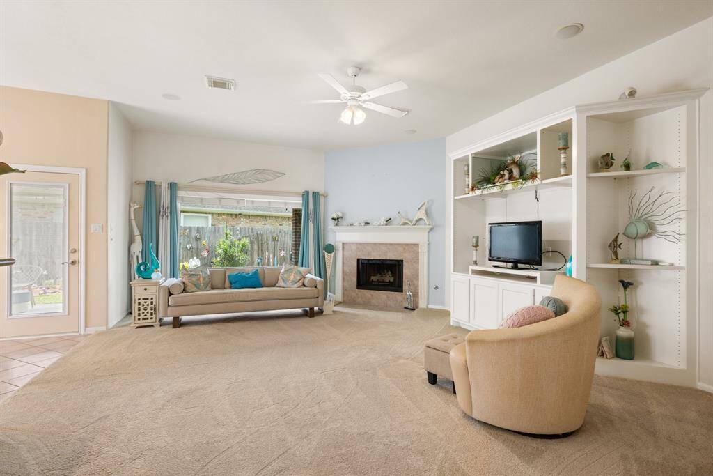 The gas fireplace helps make the den cozy during the few cold days that we have in Houston.