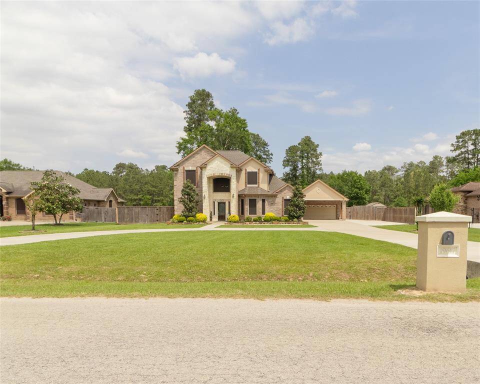 Spacious two-story brick home with beautifully maintained landscaping, long wide driveway with plenty of room for cars and recreational vehicles.