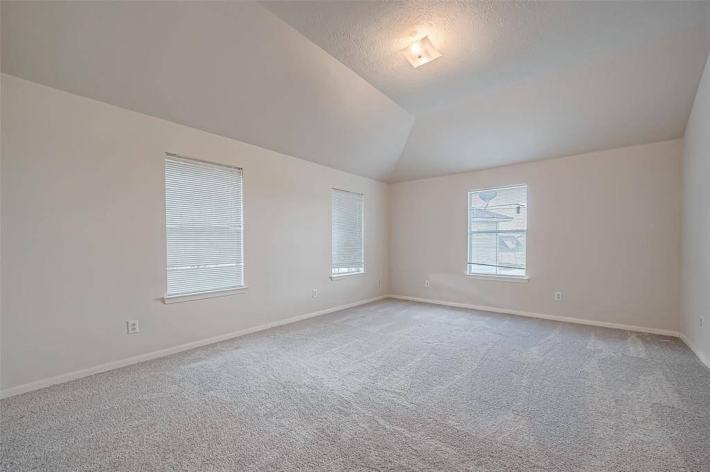 From another angle, the landing’s spaciousness is evident, making it a flexible extension of the upper level.