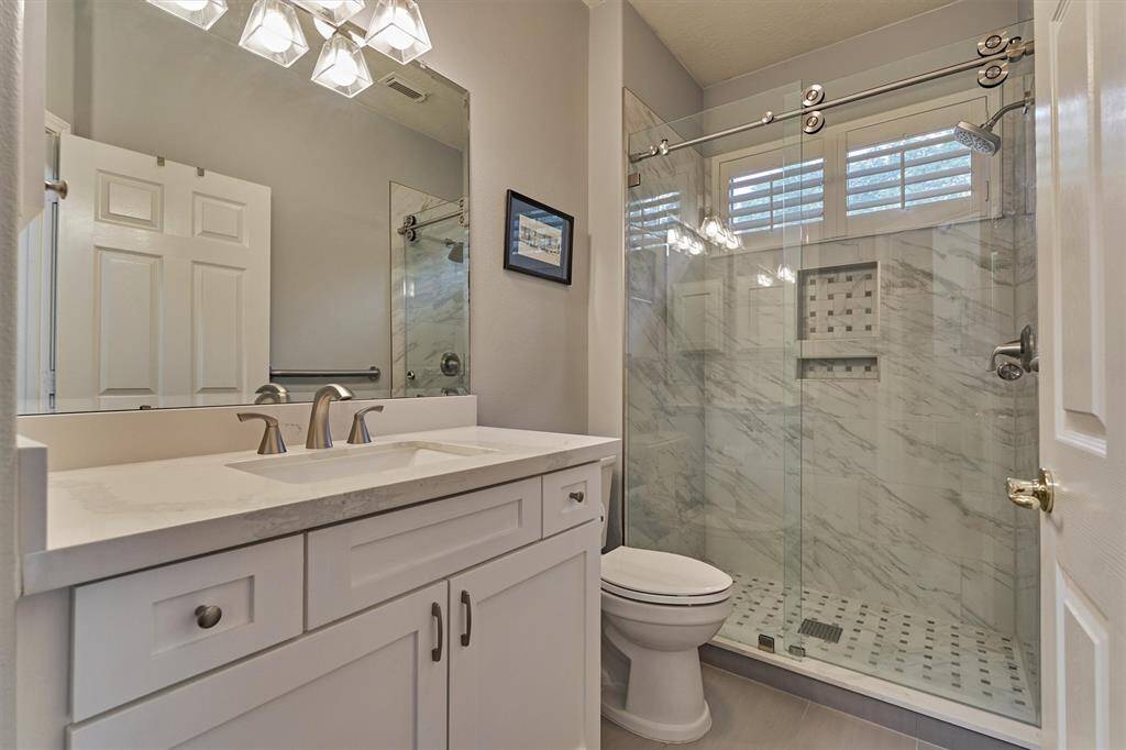 The remodeled bathroom designated for the secondary bedrooms.