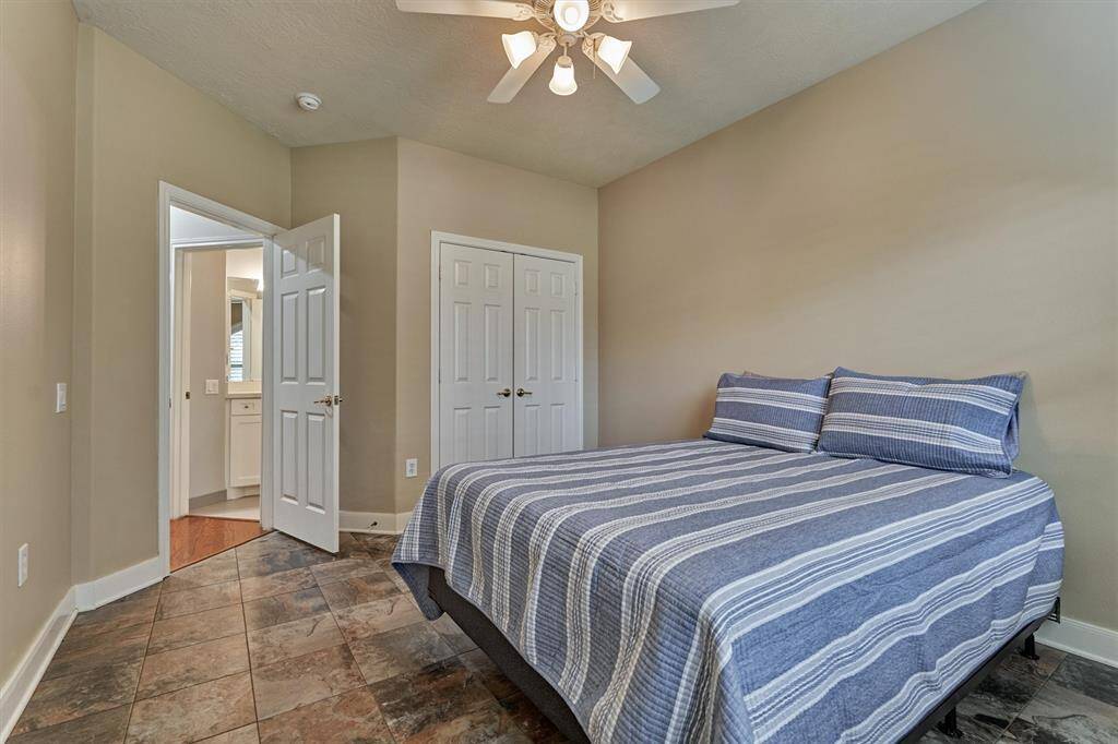 The second of the two secondary bedrooms with a walk-in closet.