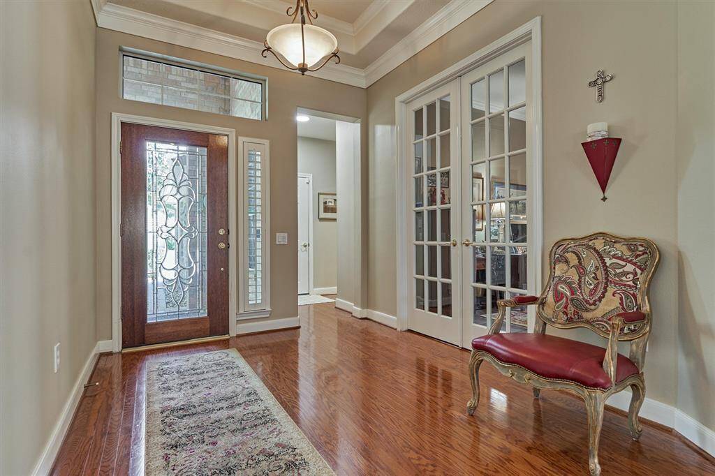 The front door, made of leaded glass and wood, is stunning.