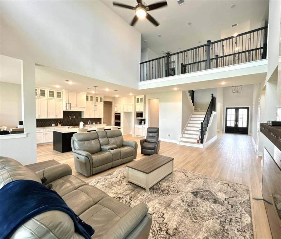 Beautiful view of the grand entry way, family room and upstairs!
