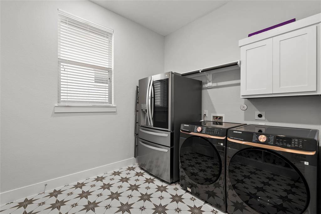 Large utility room located in house with plenty of space for an additional fridge or freezer.