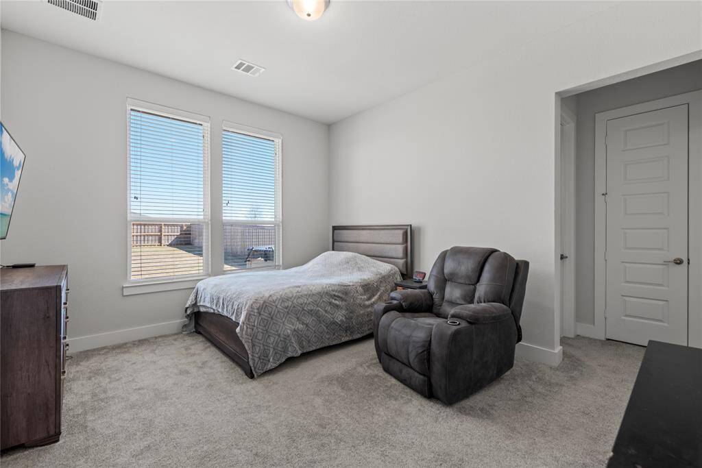Secondary bedroom with ensuite located on the first floor. Perfect for guests or live in family members